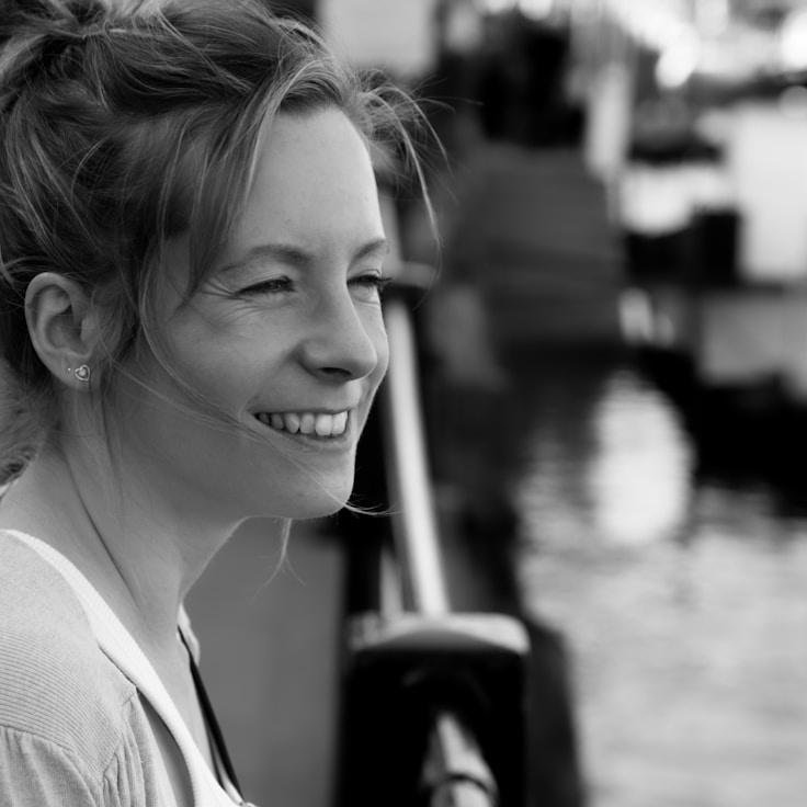 Kaveri Mehta, Lead Design Curator at StonePixelHub, reviewing corporate floral arrangements